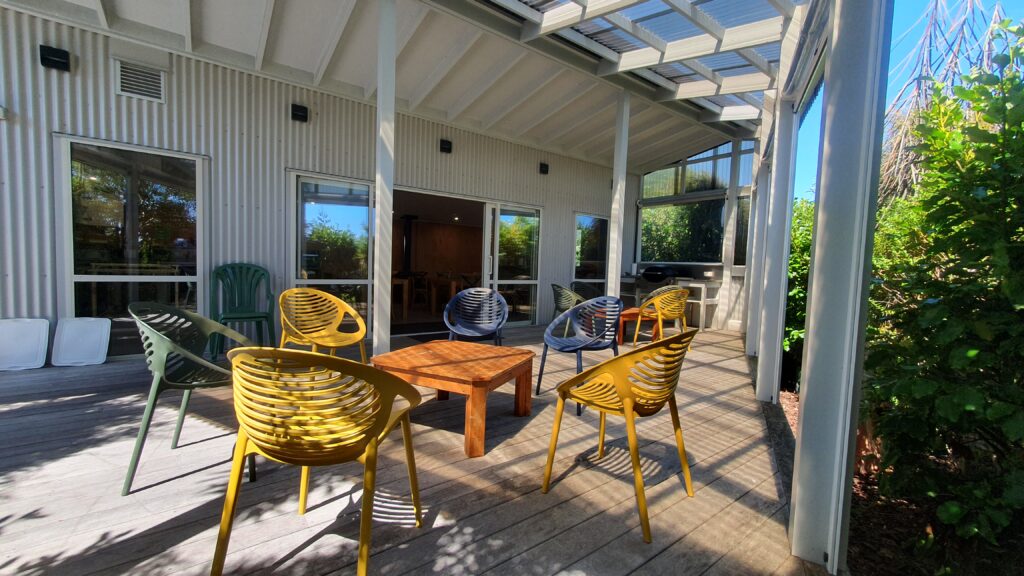 Covered in exterior deck. BBQ. Outdoor seating/dining