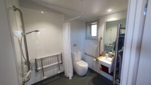 Accessible shower and toilet in private bathroom